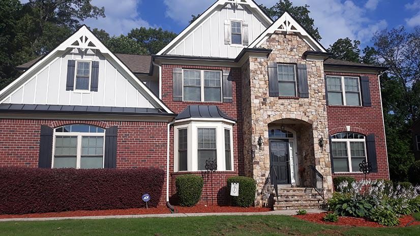 New seamless gutters on a brick home