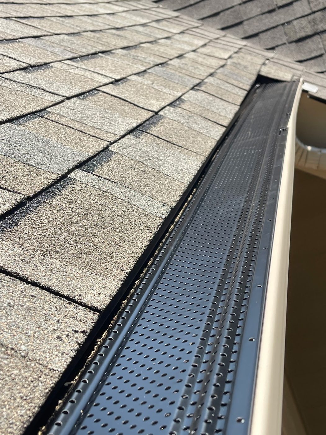 Leaf guard installed over a new seamless gutter